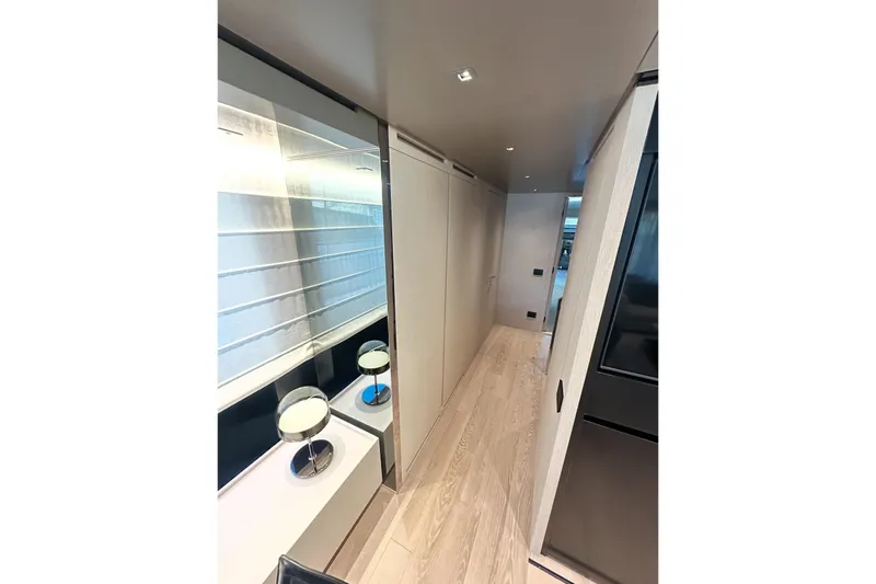 Saam II Yacht Photos Pics Luxurious interior hallway of 2024 Sanlorenzo SL96 yacht, featuring modern design and elegant lighting.