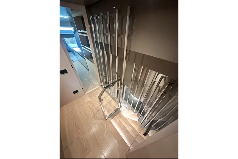 Saam II Yacht Photos Pics Elegant staircase in 2024 Sanlorenzo SL96 yacht interior, featuring modern design and wood flooring.