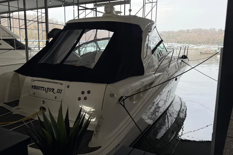  Yacht Photos Pics 2007 Sea Ray Sundancer 400 docked, featuring sleek design and covered cockpit.