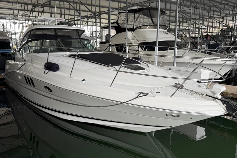  Yacht Photos Pics 2007 Sea Ray Sundancer 400 yacht docked in a marina under a covered structure.