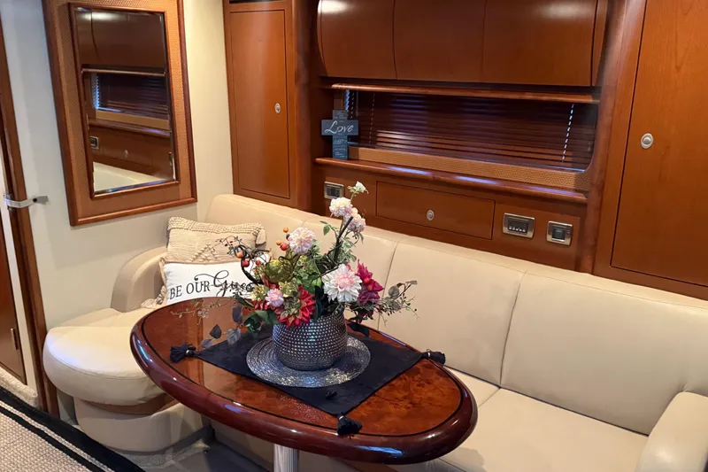  Yacht Photos Pics Luxurious interior of 2007 Sea Ray Sundancer 400 with elegant seating and floral centerpiece.