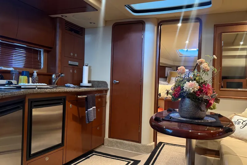  Yacht Photos Pics Luxurious interior of 2007 Sea Ray Sundancer 400 yacht with elegant decor and modern amenities.