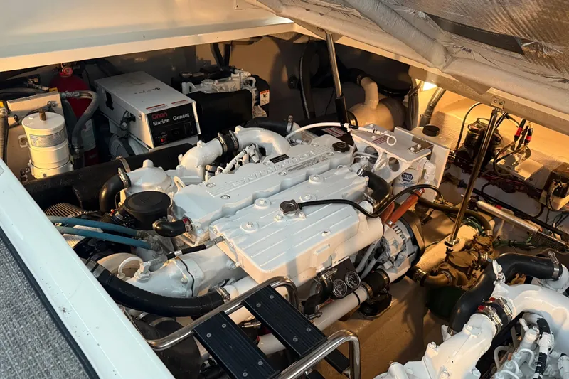  Yacht Photos Pics Engine room of a 2007 Sea Ray Sundancer 400 with visible marine generator.