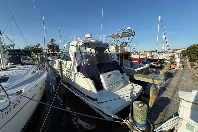  Yacht Photos Pics 2016 Formula 37 Performance Cruiser docked at a marina, surrounded by other boats.