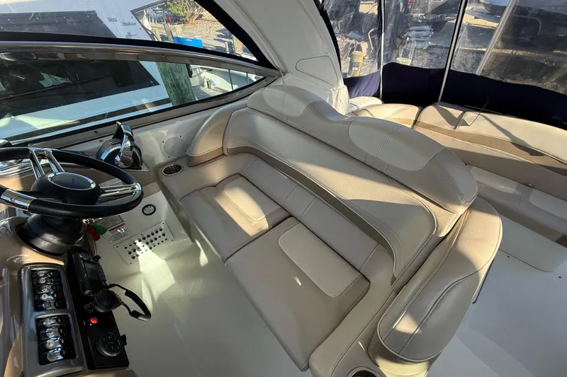  Yacht Photos Pics Interior of 2016 Formula 37 Performance Cruiser with beige seating and steering controls.