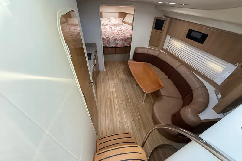  Yacht Photos Pics Interior of 2016 Formula 37 Performance Cruiser with seating, table, and bed.