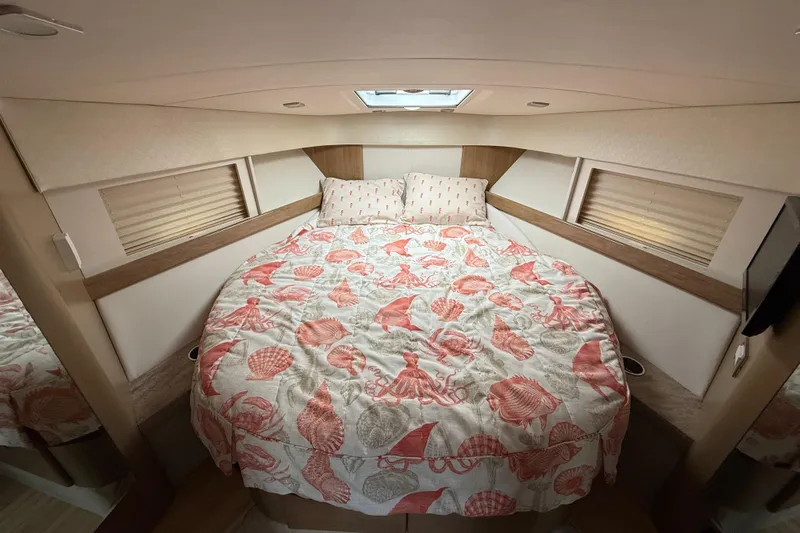  Yacht Photos Pics Cozy cabin interior of 2016 Formula 37 Performance Cruiser with seashell-themed bedding.