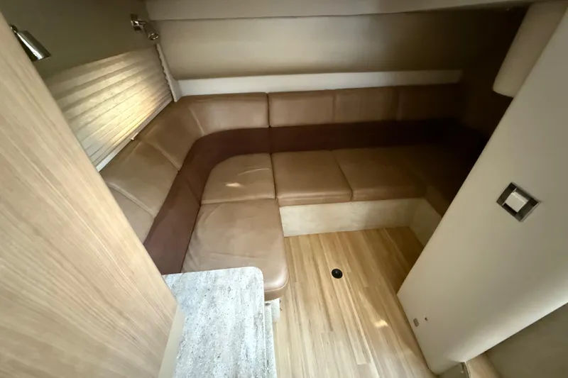  Yacht Photos Pics 2016 Formula 37 Performance Cruiser interior with beige leather seating and wooden flooring.