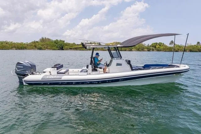  Yacht Photos Pics 2018 RIB CVL Colt 35 boat on water with canopy and Yamaha engine.