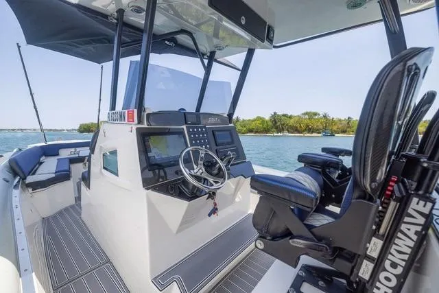  Yacht Photos Pics 2018 RIB CVL Colt 35 boat interior with steering wheel and seating, on a sunny day.