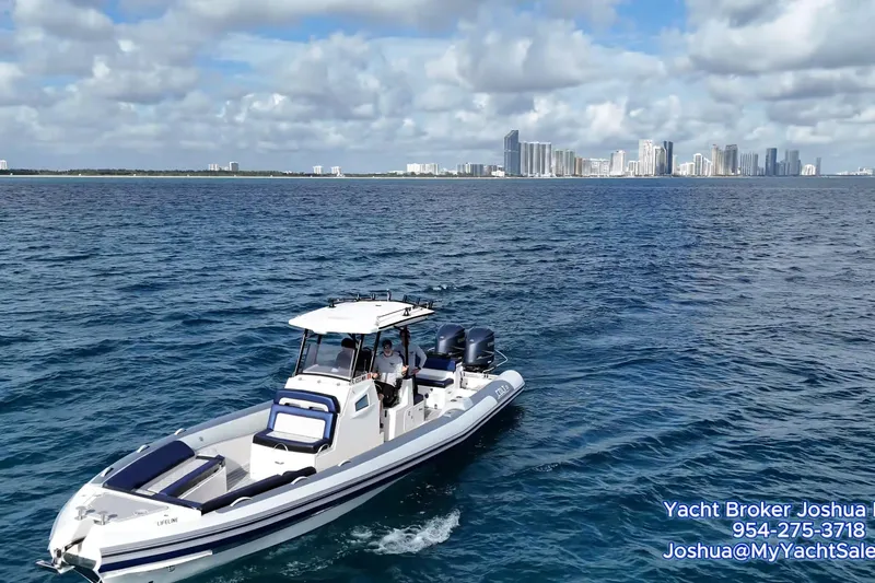  Yacht Photos Pics 2018 RIB CVL Colt 35 boat cruising near city skyline on a sunny day.