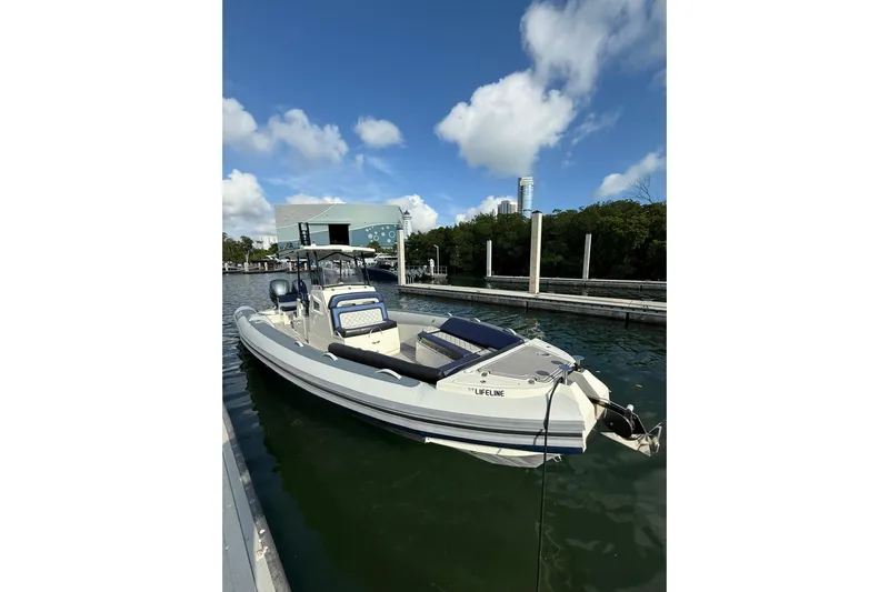  Yacht Photos Pics 2018 RIB CVL Colt 35 boat docked in marina under blue sky.