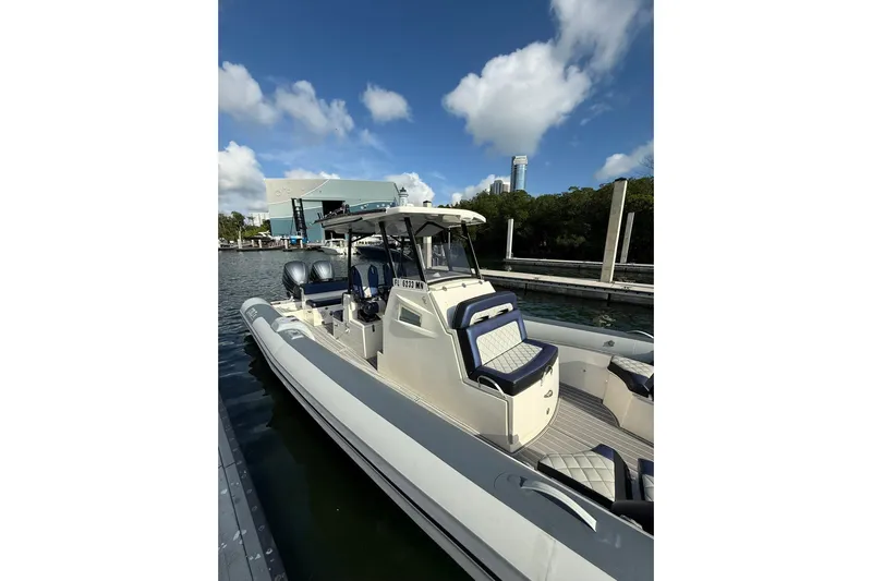  Yacht Photos Pics 2018 RIB CVL Colt 35 boat docked, featuring sleek design and dual engines.