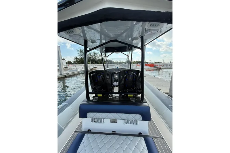  Yacht Photos Pics 2018 RIB CVL Colt 35 boat interior with seating and control console at dock.