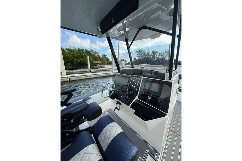  Yacht Photos Pics 2018 RIB CVL Colt 35 boat cockpit with modern controls and blue seating.