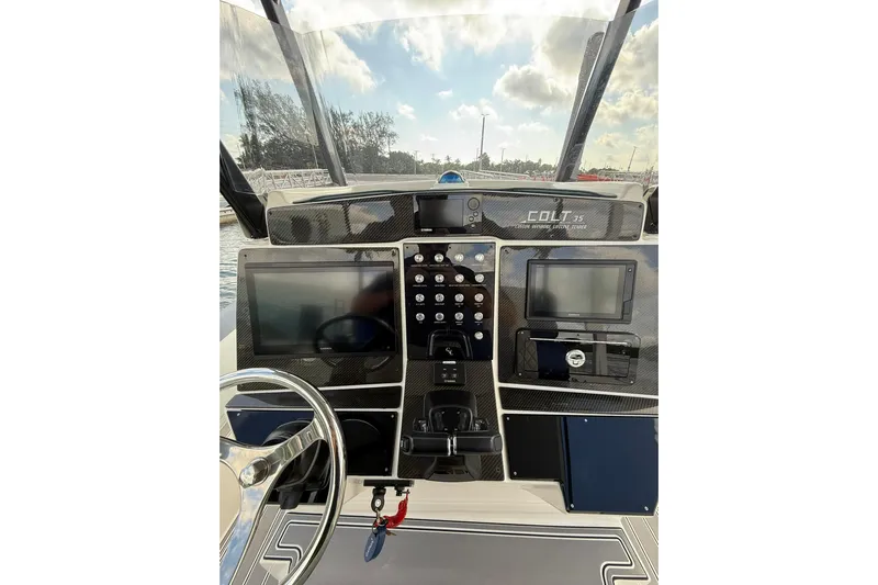  Yacht Photos Pics 2018 RIB CVL Colt 35 boat dashboard with modern navigation equipment and steering wheel.