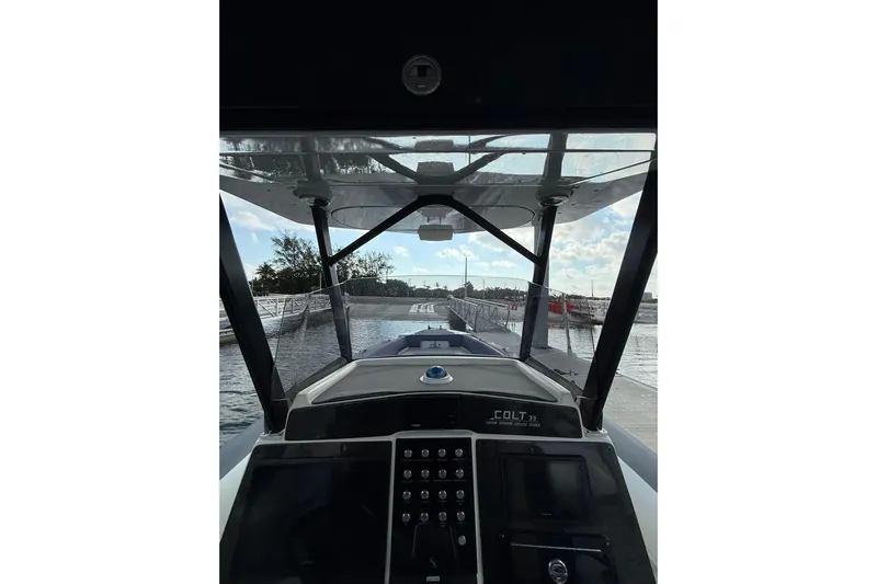  Yacht Photos Pics Cockpit view of 2018 RIB CVL Colt 35 boat, featuring modern controls and clear canopy.