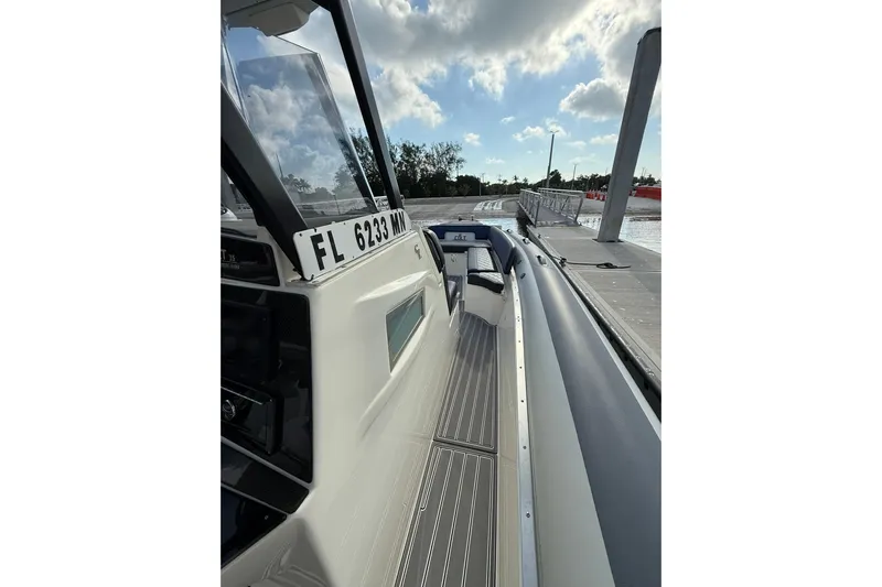  Yacht Photos Pics 2018 RIB CVL Colt 35 boat docked, showcasing sleek design and registration number.