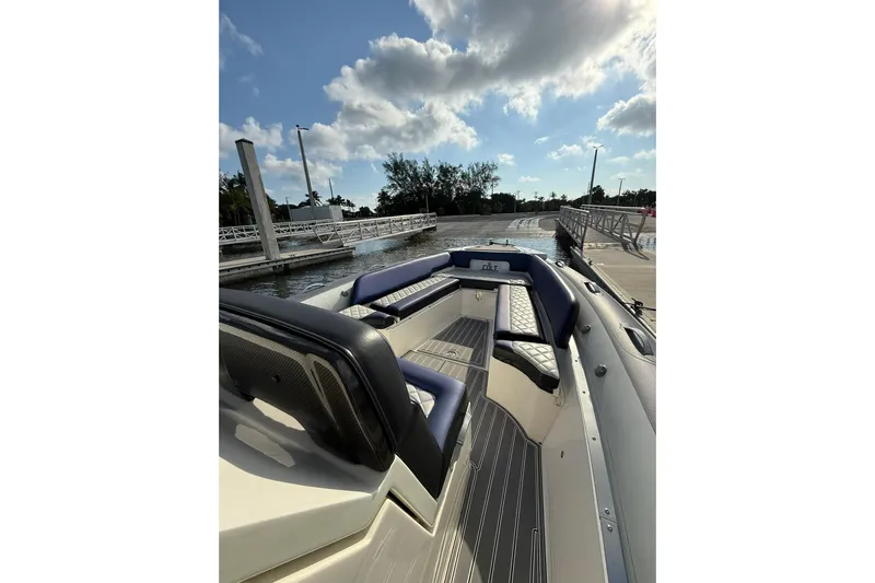  Yacht Photos Pics 2018 RIB CVL Colt 35 boat docked, featuring sleek seating and modern design under a partly cloudy sky.