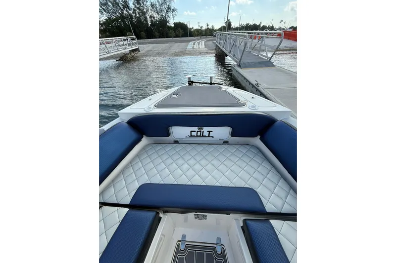  Yacht Photos Pics 2018 RIB CVL Colt 35 boat interior with blue and white seating at dock.