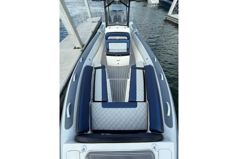  Yacht Photos Pics 2018 RIB CVL Colt 35 boat with sleek seating and modern design at a dock.