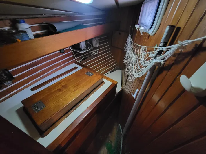 Searcher Yacht Photos Pics Interior of 1981 Tayana Vancouver 42 sailboat with wooden cabinetry and storage space.