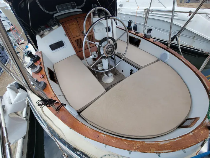 Searcher Yacht Photos Pics 1981 Tayana Vancouver 42 sailboat cockpit with wheel, seating, and winches.