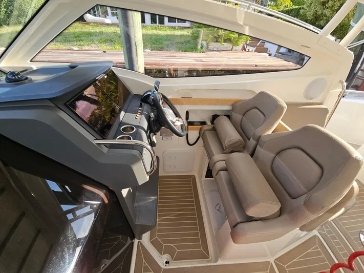  Yacht Photos Pics Interior of 2020 Nimbus Weekender 9 boat with modern helm and comfortable seating.