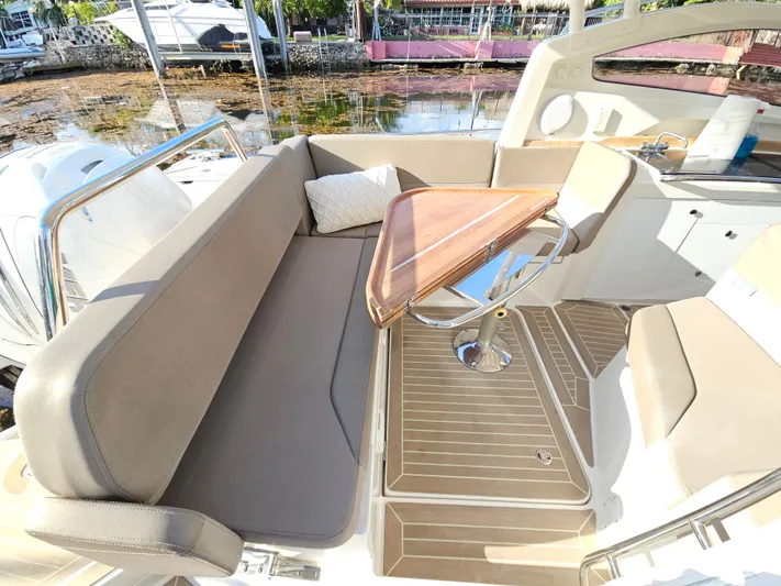  Yacht Photos Pics Interior of 2020 Nimbus Weekender 9 boat with seating and wooden table.