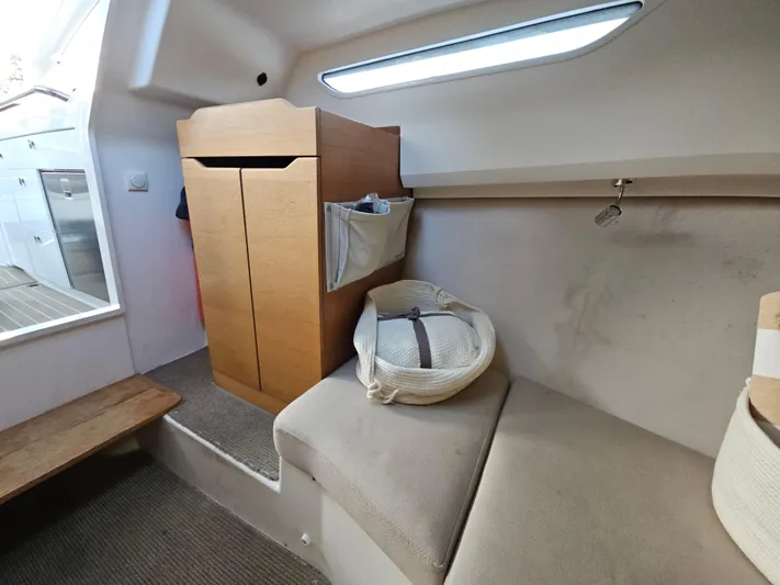  Yacht Photos Pics Interior of 2020 Nimbus Weekender 9 boat with cozy seating and wooden cabinetry.