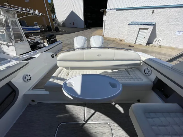  Yacht Photos Pics 2021 Cobalt 30SC Outboard boat interior with seating and table.