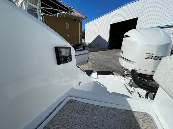  Yacht Photos Pics 2021 Cobalt 30SC Outboard boat with Yamaha engine in a marina setting.