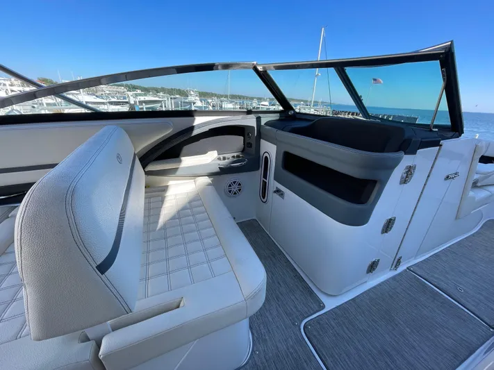  Yacht Photos Pics 2021 Cobalt 30SC Outboard boat interior with white seating and sleek design.
