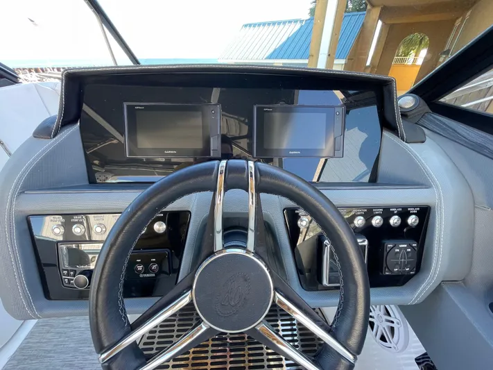  Yacht Photos Pics 2021 Cobalt 30SC Outboard dashboard with dual displays and steering wheel.
