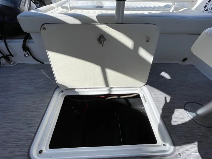  Yacht Photos Pics Open storage compartment on 2021 Cobalt 30SC Outboard boat deck.