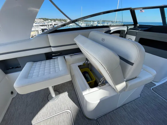 Yacht Photos Pics 2021 Cobalt 30SC Outboard boat interior with open storage compartment and seating.