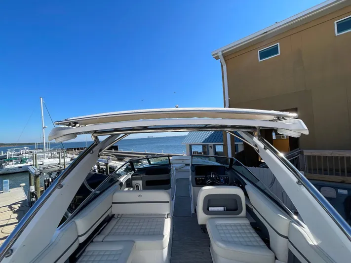  Yacht Photos Pics 2021 Cobalt 30SC Outboard boat docked at marina under clear blue sky.