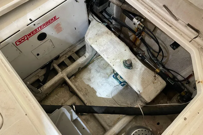 Mokikem Yacht Photos Pics Lazarette with Westerbeke generator in sound shield.