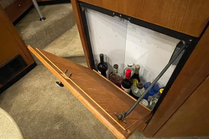 Mokikem Yacht Photos Pics Original TV cabinet turned into bar.