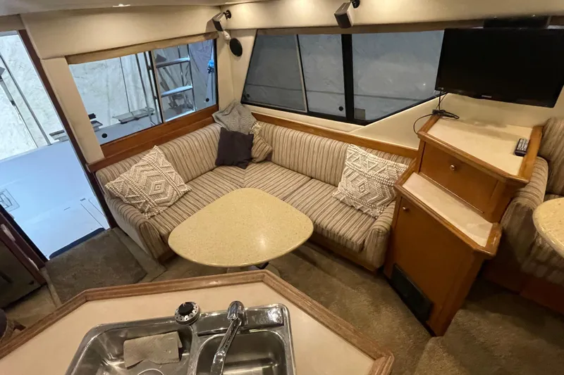 Mokikem Yacht Photos Pics Lower salon with flatscreen TV.