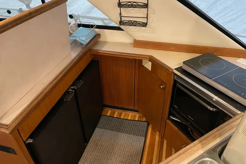 Mokikem Yacht Photos Pics Galley with 2 burner induction stove, micro/convection/steam oven, dual sinks and dual under counter fridges.