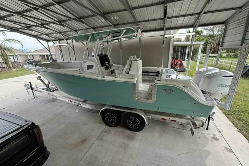  Yacht Photos Pics 2021 Sea Fox 288 Commander boat on trailer under metal canopy.