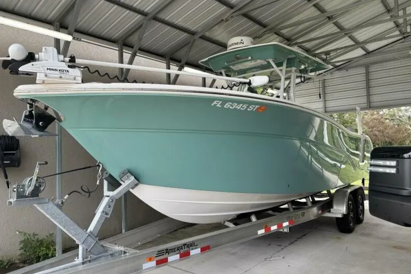  Yacht Photos Pics 2021 Sea Fox 288 Commander boat on trailer under metal roof.