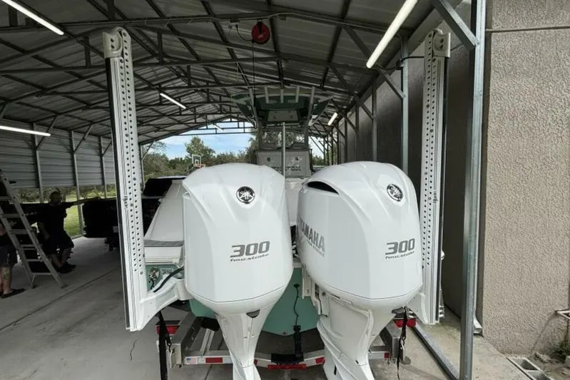  Yacht Photos Pics 2021 Sea Fox 288 Commander with twin Yamaha 300 engines in a covered storage.