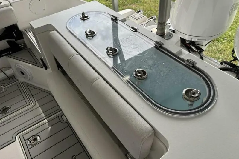  Yacht Photos Pics 2021 Sea Fox 288 Commander boat interior with livewell and seating area.