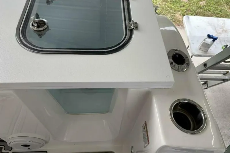  Yacht Photos Pics 2021 Sea Fox 288 Commander boat detail with storage compartment and cup holders.