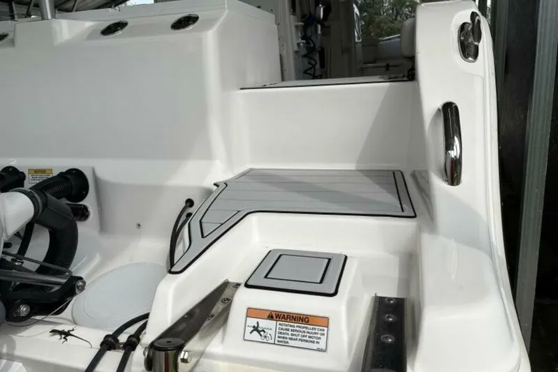  Yacht Photos Pics 2021 Sea Fox 288 Commander boat deck with warning label and sleek design.