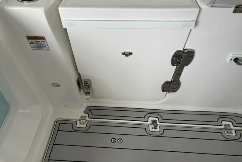  Yacht Photos Pics 2021 Sea Fox 288 Commander boat interior with storage compartment and non-slip flooring.