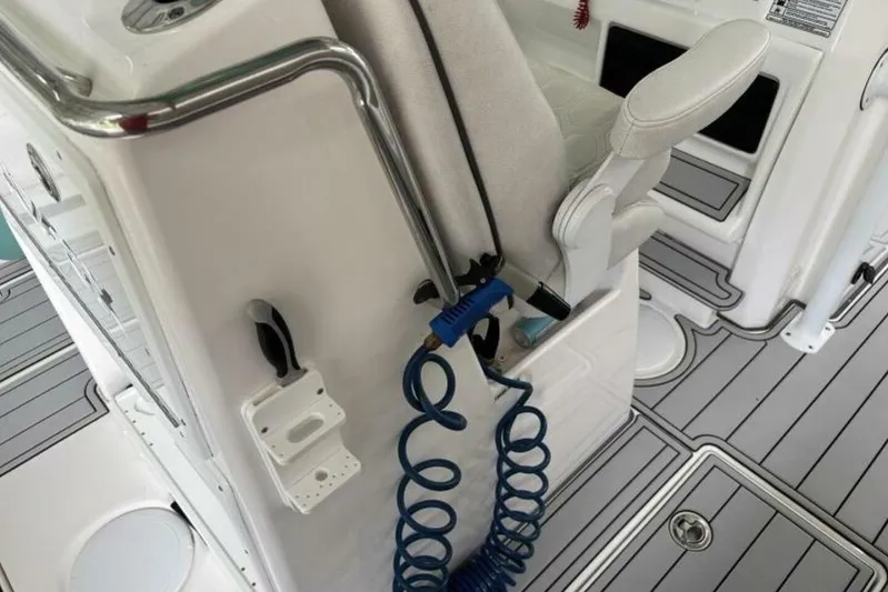  Yacht Photos Pics 2021 Sea Fox 288 Commander boat interior with seating and coiled blue hose.