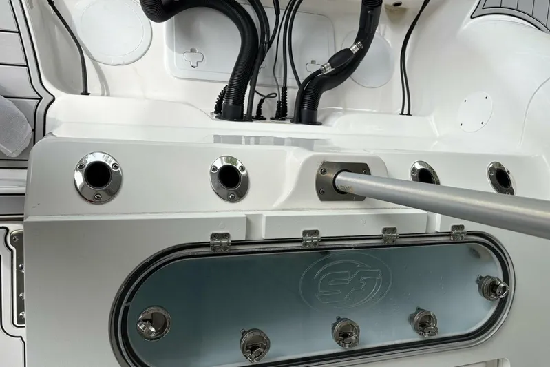  Yacht Photos Pics 2021 Sea Fox 288 Commander boat interior with rod holders and storage compartment.